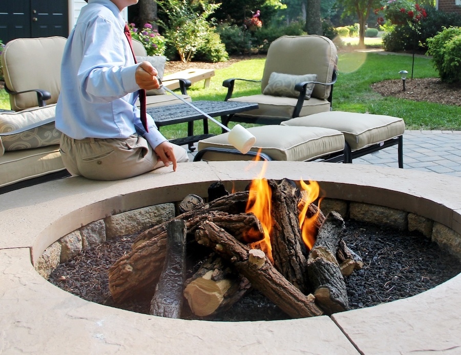 genz-teen-in-the-backyard-enjoying-the-fire-pit-2021-09-24-05-21-22-utc