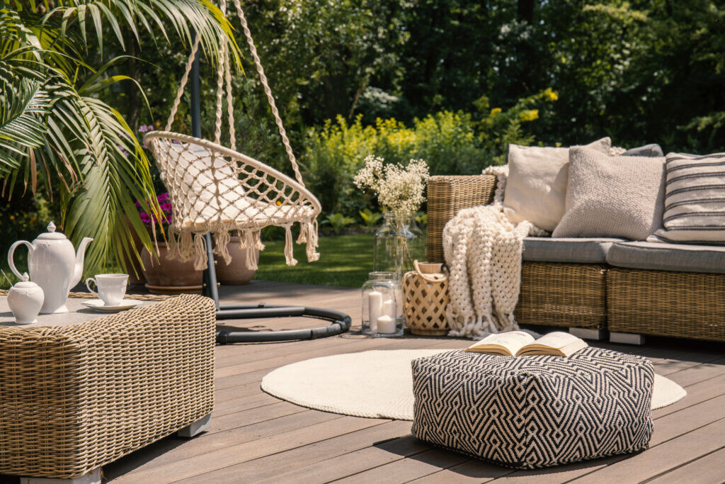 pouf-on-wooden-terrace-with-rattan-sofa-and-table-WYQT2RV-1024x683